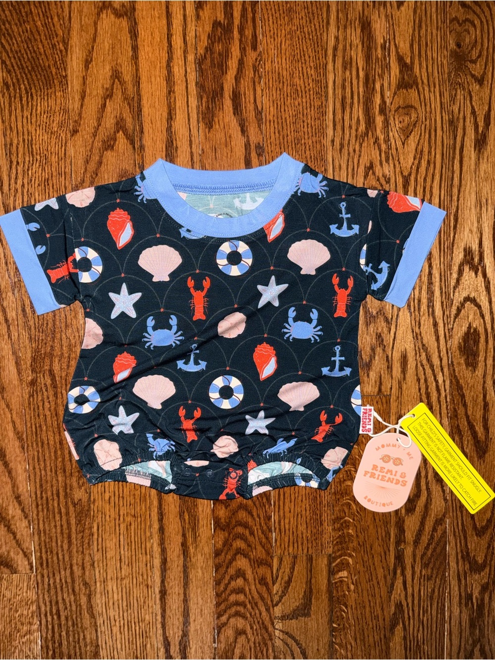 FRIENDS Navy One-Piece Bodysuit with Light Blue Trim and Coral Nautical Print
